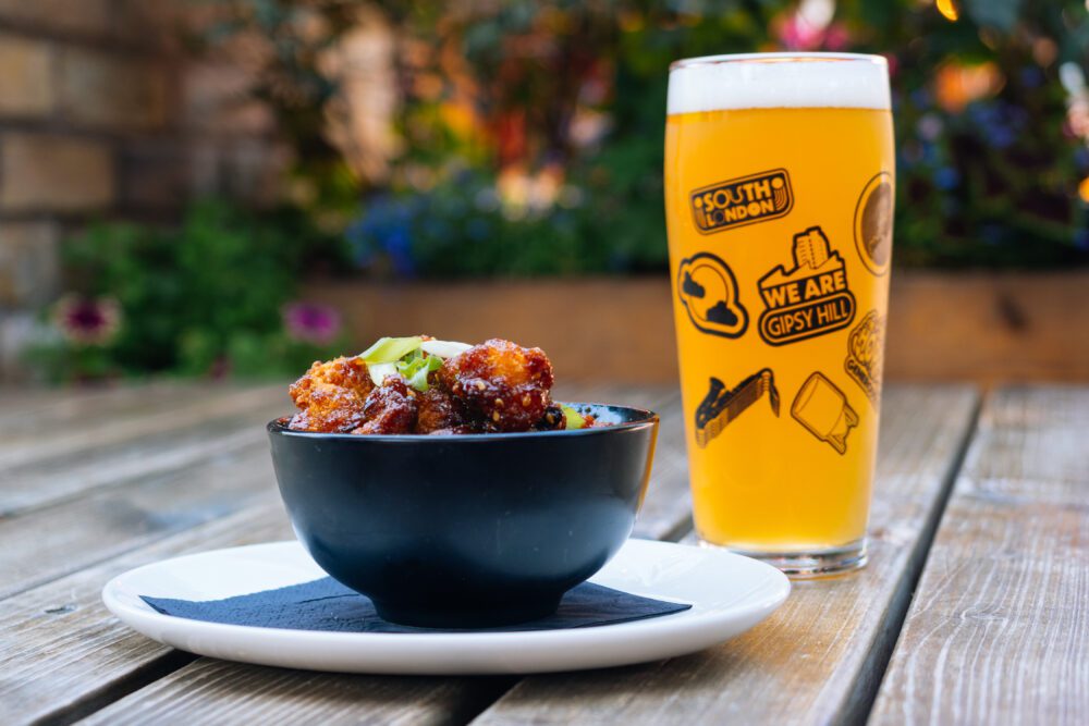 Pint of beer and chicken bites, perfect for a casual meal at The Fox Pub Hanwell